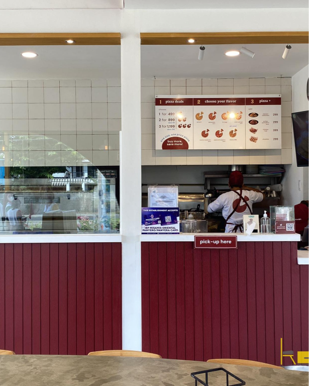 Demetrios Pizzeria's modern design is evident in this image of its clean and efficient kitchen area.